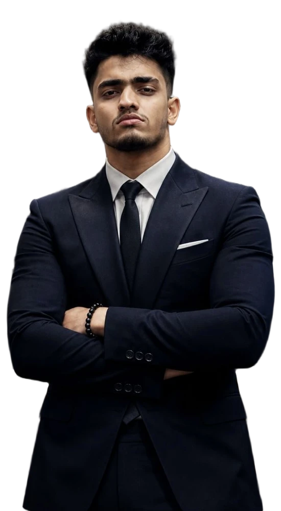 Lakindu Pahesara, in a navy suit with his arms folded